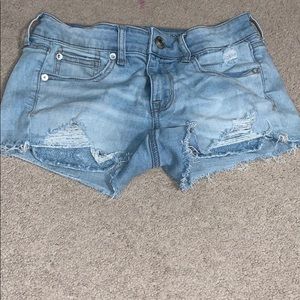 light wash A&E shorts, distressed